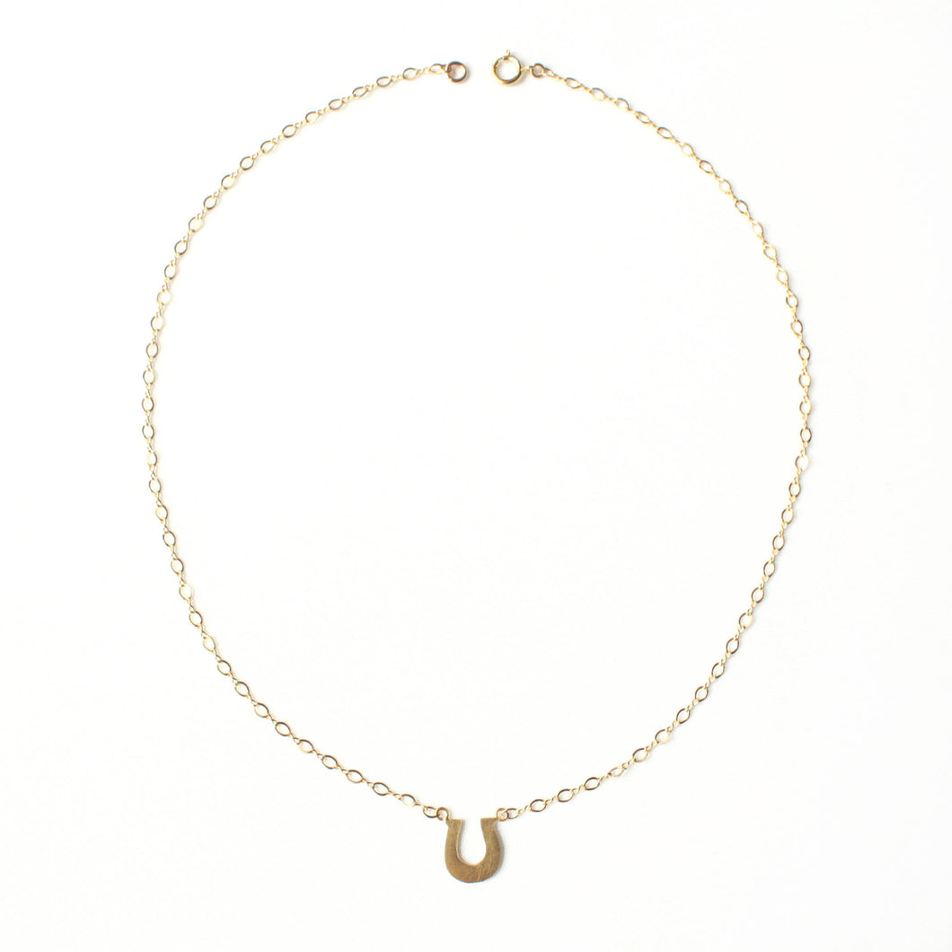 Horseshoe Swing Necklace in Gold