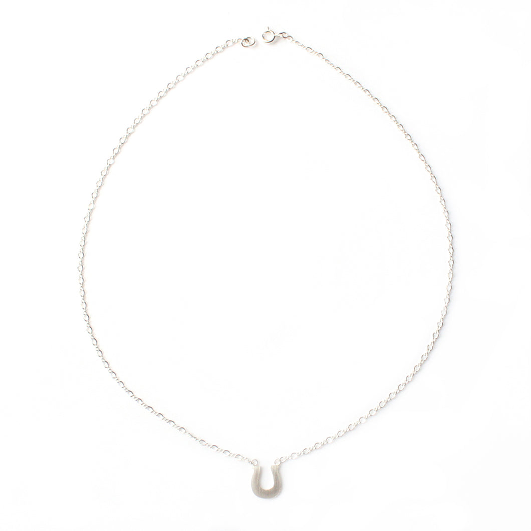 Horseshoe Swing Necklace in Silver